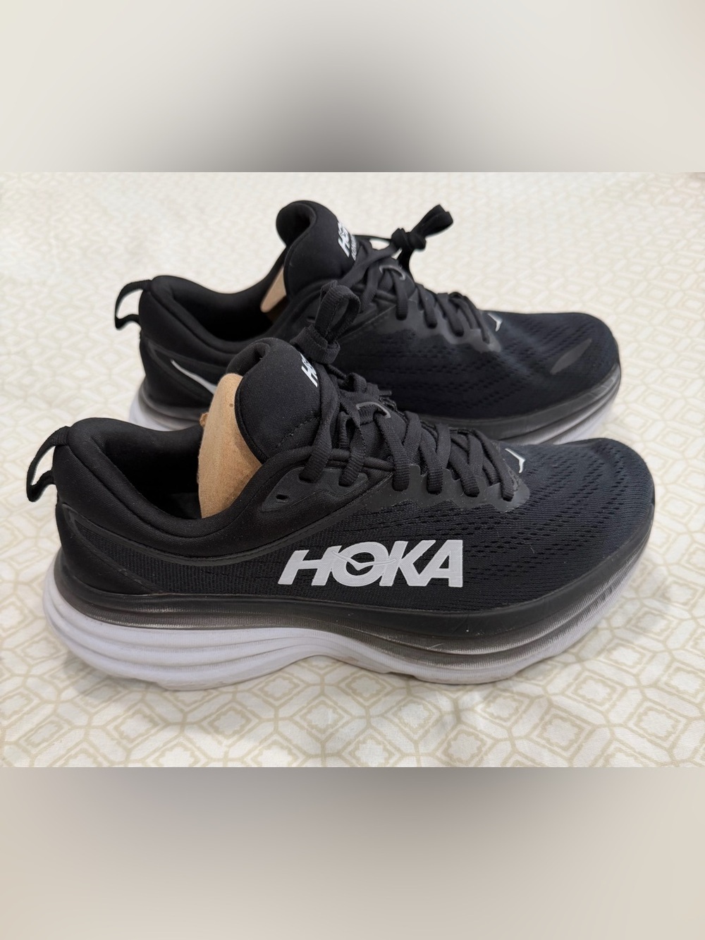 Hoka woman’s Black Athletic Running Shoes with White Logo